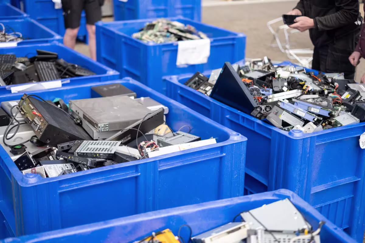 Sorted electronic waste in bins ready for processing